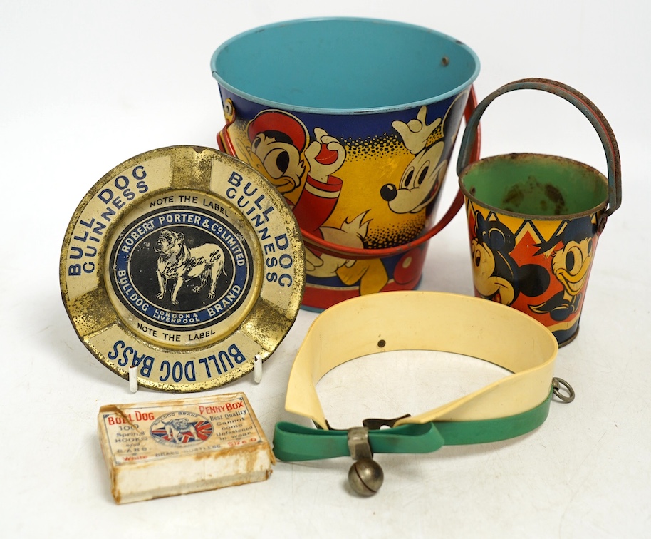 A vintage Bull Dog Bass and Guinness tinplate advertising ashtray, two Happynak Mickey Mouse toy buckets, a bakelite dog collar, etc. (5). Condition - fair